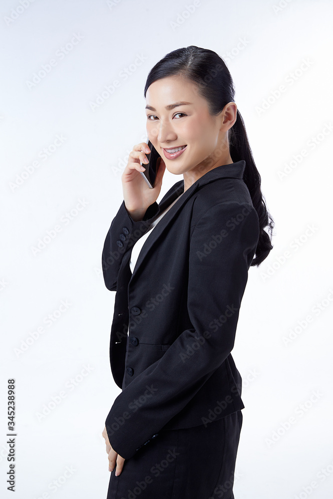 business woman in a black suit is happy and holding a phone Glad to succeed. Business Concept, Online, Internet business woman in a black suit is happy and holding a phone Glad to succeed. Business Concept, Online, Internet