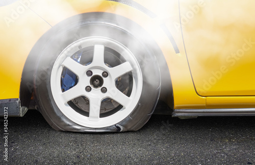 burst car tire on road photo