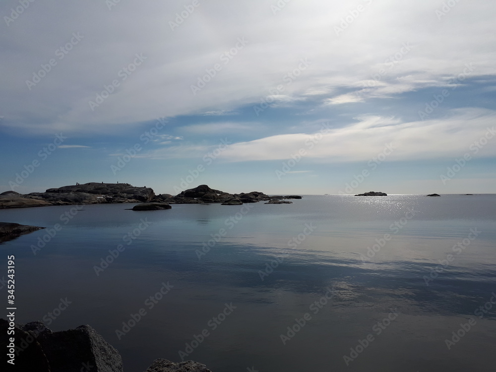 Landscape with a rocky coast over the blue sea - Verdens Ende 