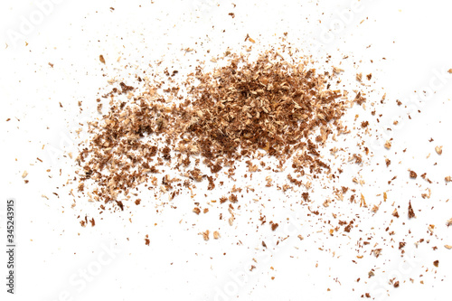 Small wooden shavings of sawdust on a white background. photo
