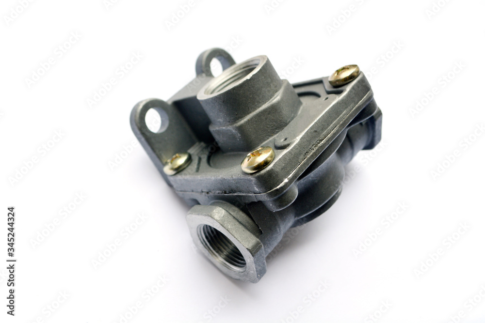 Quick release valve of the truck's pneumatic brake system on a white background. Spare parts. Quick release valve of the truck's pneumatic brake system on a white background. Spare parts.
