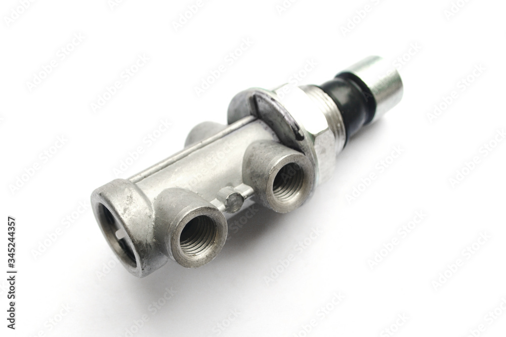 Truck emergency release valve with pneumatic brake system on an isolated white background. Spare parts. Truck emergency release valve with pneumatic brake system on an isolated white background. Spare parts.