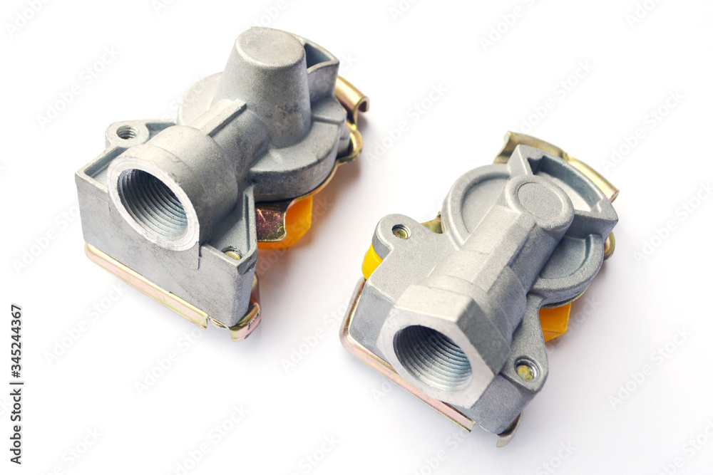 Pneumatic connecting heads with a valve on an isolated white background. Spare parts. Pneumatic connecting heads with a valve on an isolated white background. Spare parts.