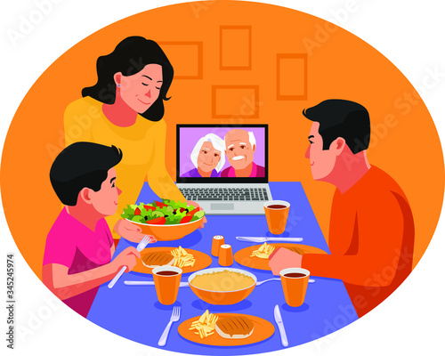 Ramadan in the time of corona. Happy family having dinner together. Video chat with family elders during dinner. Iftar eating after fasting. Stay home covid-19 concept.