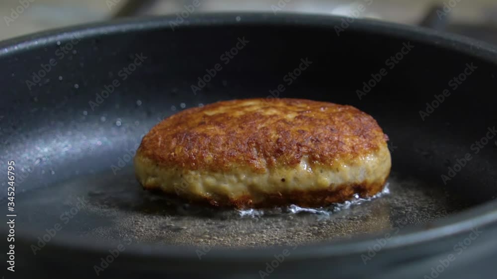 Appetizing cutlet close up fried in a frying pan. Juicy delicious meat cutlets in a frying Pan are Fried On the Stove in oil. Roasted cutlets in a pan. Frying process Appetizing cutlet close up fried in a frying pan. Juicy delicious meat cutlets in a frying Pan are Fried On the Stove in oil. Roasted cutlets in a pan. Frying process