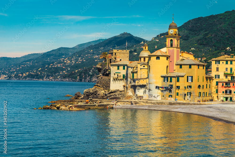 Mediterranean coastline and Camogli resort with colorful buildings, Liguria, Italy