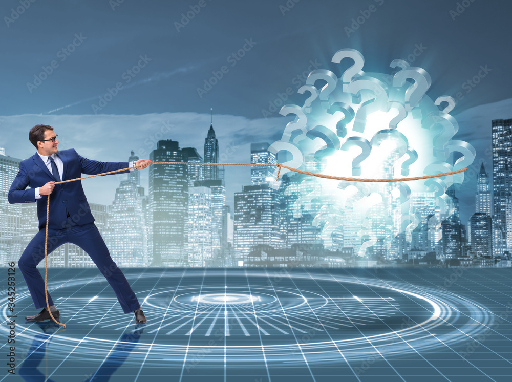 Obraz premium Businessman pulling question marks in uncertainty concept