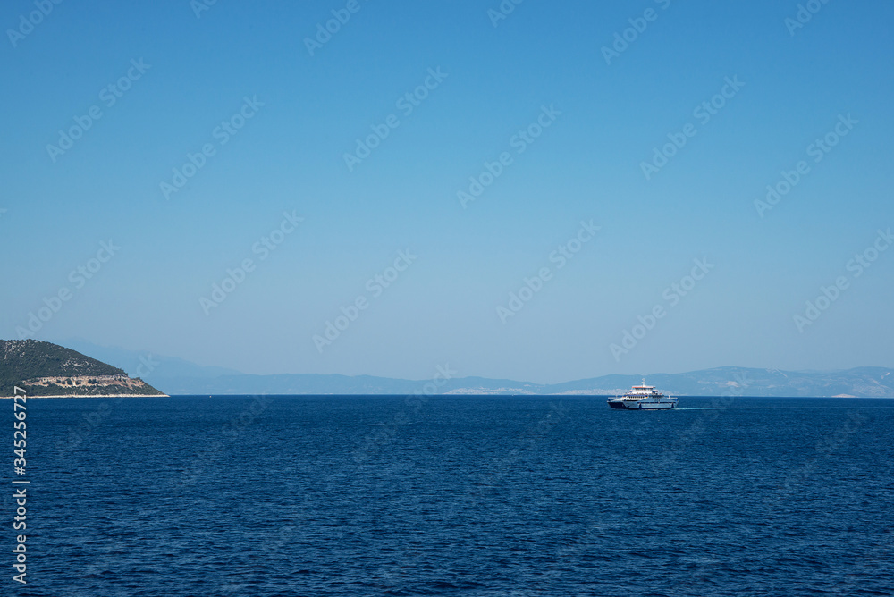 Aegean sea coast in Greece, passenger ship