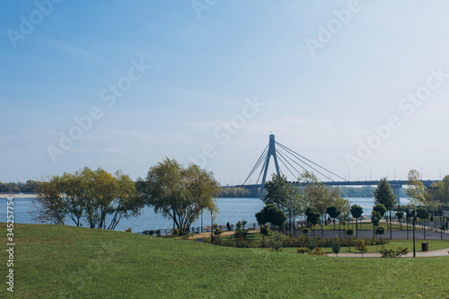view of the bridge over the river from the city park © Александр Варуха