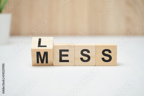 Less mess words on wooden blocks.