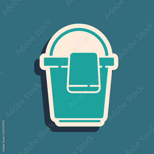 Green Bucket with rag icon isolated on green background. Cleaning service concept. Long shadow style. Vector Illustration