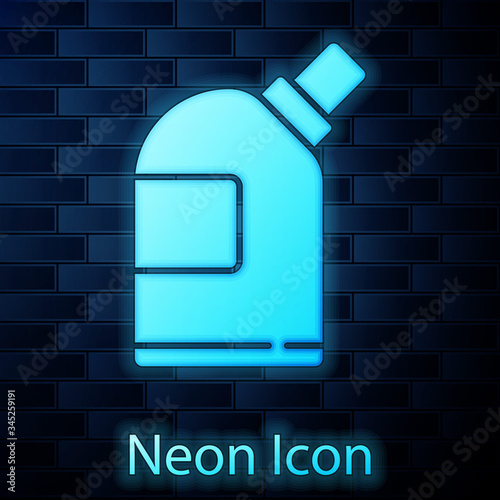 Glowing neon Plastic bottles for laundry detergent, bleach, dishwashing liquid or another cleaning agent icon isolated on brick wall background.  Vector Illustration