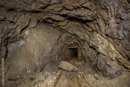Underground old abandoned iron mine tunnel with doors
