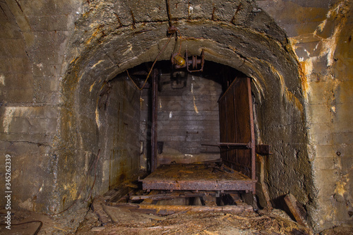 Underground old abandoned iron mine tunnel with lift