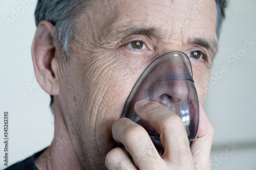 Medical oxygen mask on a man. photo