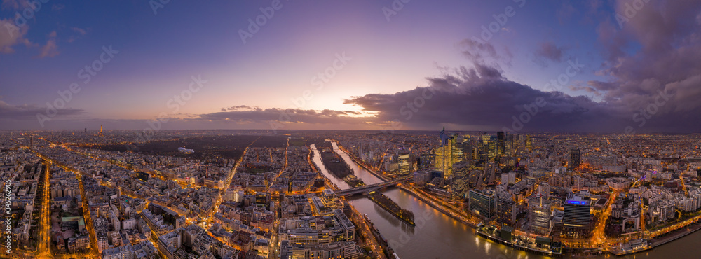 Panoramic aerial drone shot of Neuilly Levallois la defense skyscraper complex with Eiffel tower la seine during sunset hour in Paris - obrazy, fototapety, plakaty 