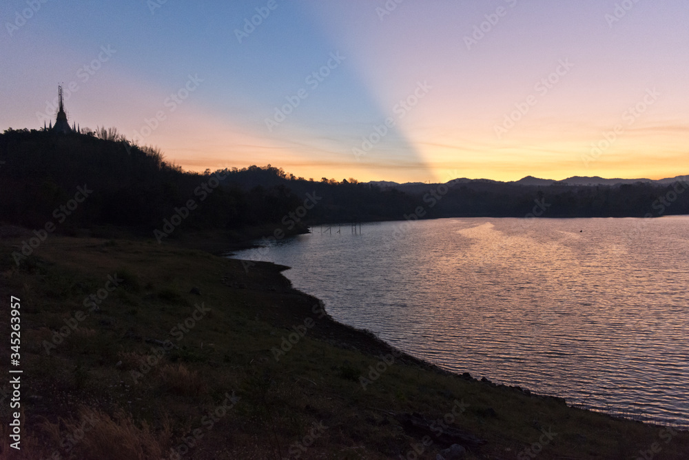 Fototapeta premium Sunrise over a Reservoir at Mae Sot, Thailand, Asia