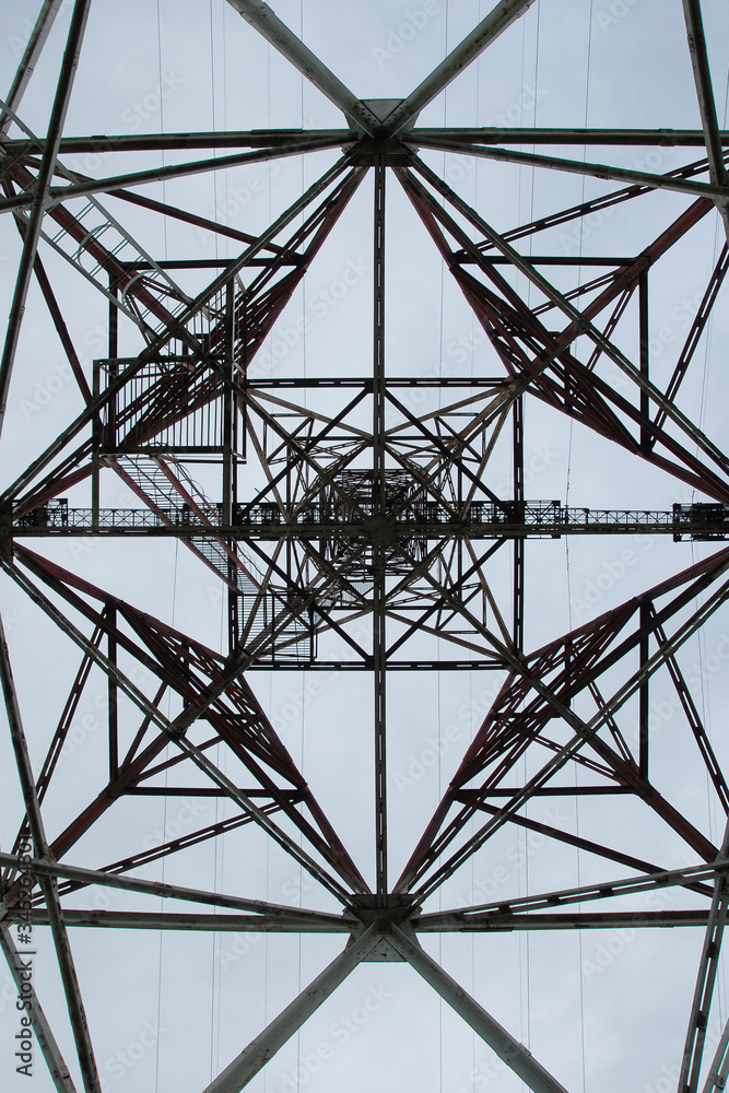 Figure of electric tower on sky background