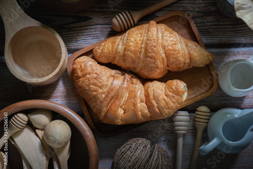 Tasty buttery croissants on  wooden table