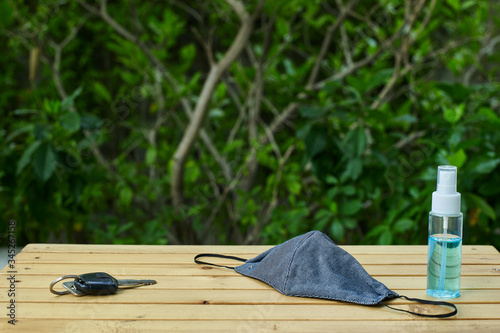 Out of the house, carry alcohol to clean hands and masks for protection against COVID-19.