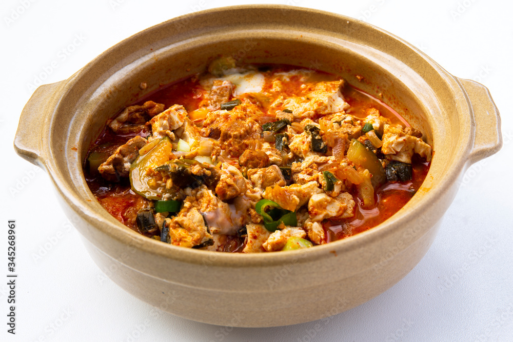 Korean spicy silken tofu stew which is called Sundubu Jjigae Korean spicy silken tofu stew which is called Sundubu Jjigae
