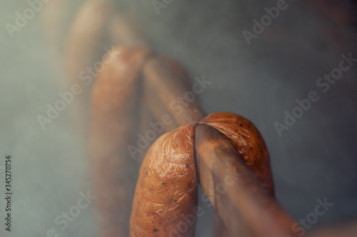 
Smoking sausages in a smokehouse photo