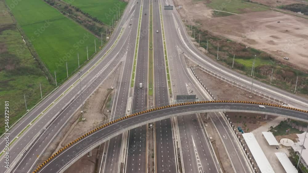 Aerial top view traffic on circle road and motorway freeway highway interchange connecting in the city at day Traffic in Bangkok Thailand 4k video Aerial top view traffic on circle road and motorway freeway highway interchange connecting in the city at day Traffic in Bangkok Thailand 4k video