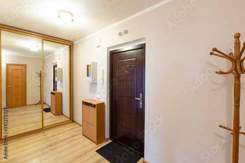 Interior of hallway apartment with furniture after the remodeling  renovation  extension  restoration  reconstruction and construction.