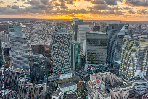 Aerial drone shot of La Defense CBD Skyscraper complex business district skyscrapers in Paris during sunset photo