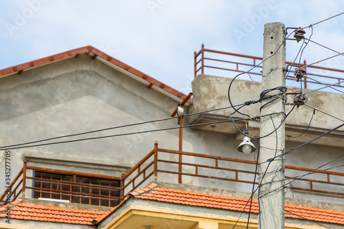 Beautifull Red-Whiskered Bulbul Bird Singing In Melodious Voice While Sitting On The Wire Outdoors.