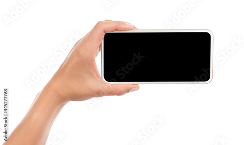 Female hand holding mobile smart phone with blank screen isolated on white background.  