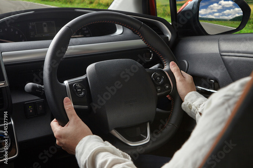 Woman hand holding steering horn