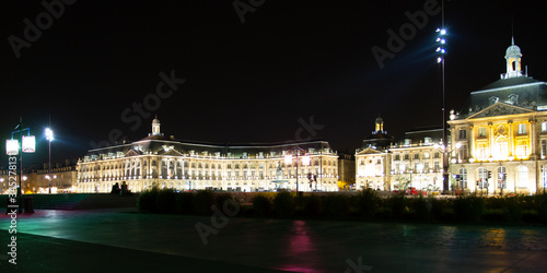 Place de la Bourse of Bordeaux city at night with water mirror front