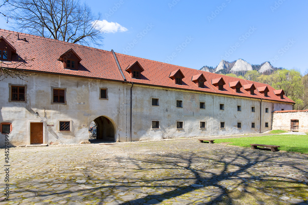 14th century Red Monastery, courtyard surrounding wall and view on Three Crowns Massif, Slovakia
