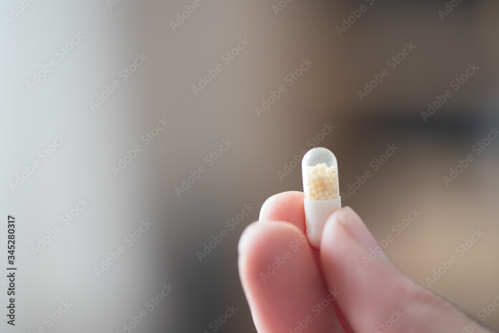 Medicament or cure concept. Close up of male hand with pills. Medicament or cure concept. Close up of male hand with pills.