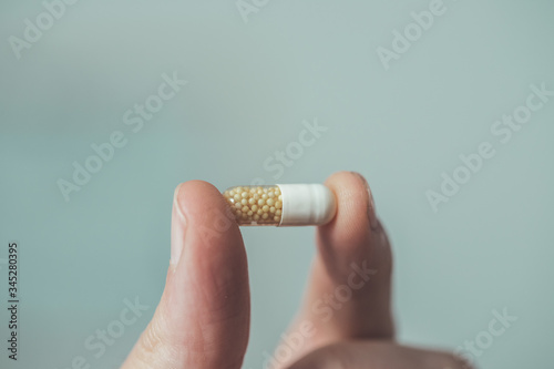 Medicament or cure concept. Close up of male hand with pills. © Patrick Daxenbichler
