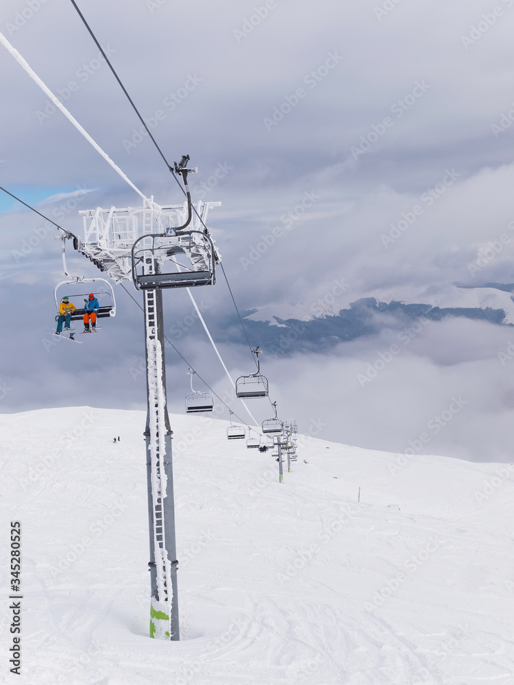 A cablaway with chairlift in a winter day A cablaway with chairlift in a winter day