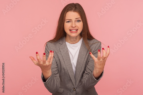 Εκτύπωση καμβά What do you want from me? Portrait of young mad woman in business suit raising hands and looking with anger hate, quarreling, annoyed by conflict