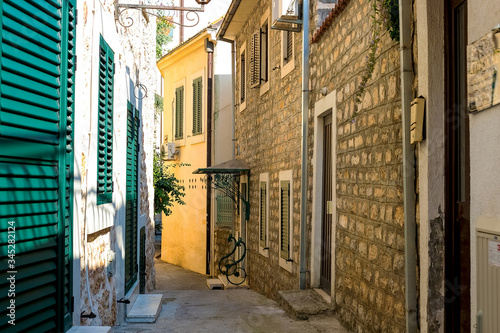 Winding street of the authentic  old town of Herceg Novi  Montenegro. We see old houses and very narrow