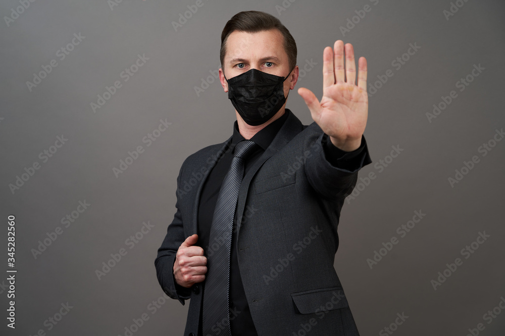 Portrait of handsome young businessman wearing medical mask Portrait of handsome young businessman wearing medical mask