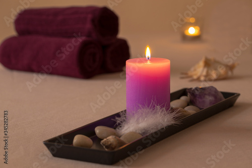 wellness spa decoration with candles and towels