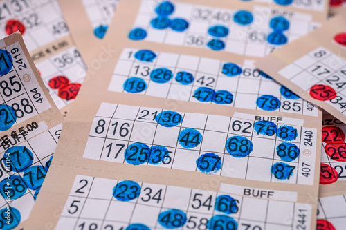 marker bingo cards piled up close up