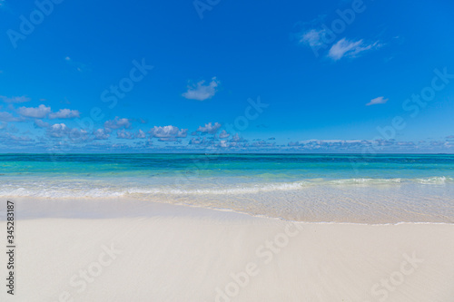 Empty tropical beach landscape. Paradise island concept  beach minimal  blue sky over white sand at exotic coastline or shoreline. Summer scenery  vacation landscape. Nature sea ocean view