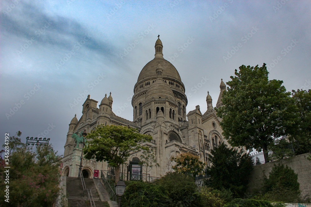 Beautiful, peaceful photo of the lonely Basilica of the Sacred Heart of Paris (Basilique du Sacré-Cœur), France at sunrise with no people