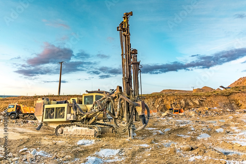 Professional drilling rig doing a geotechnical study of the terrain photo