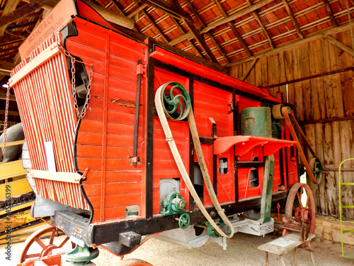 Принти на полотні Old French wooden threshing machine stored in a barn