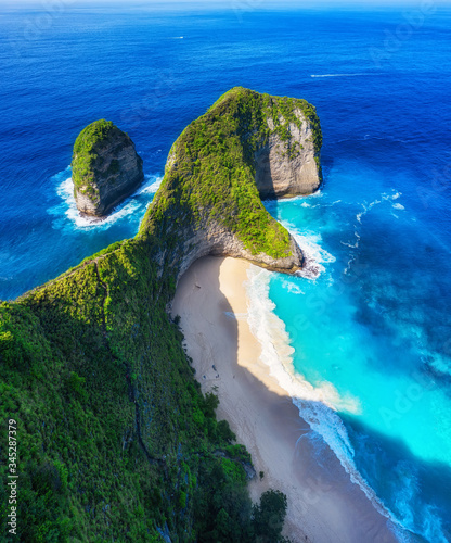Aerial view at sea and rocks. Turquoise water background from top view. Summer seascape from air. Kelingking beach, Nusa Penida, Bali, Indonesia. Travel - image © biletskiyevgeniy.com
