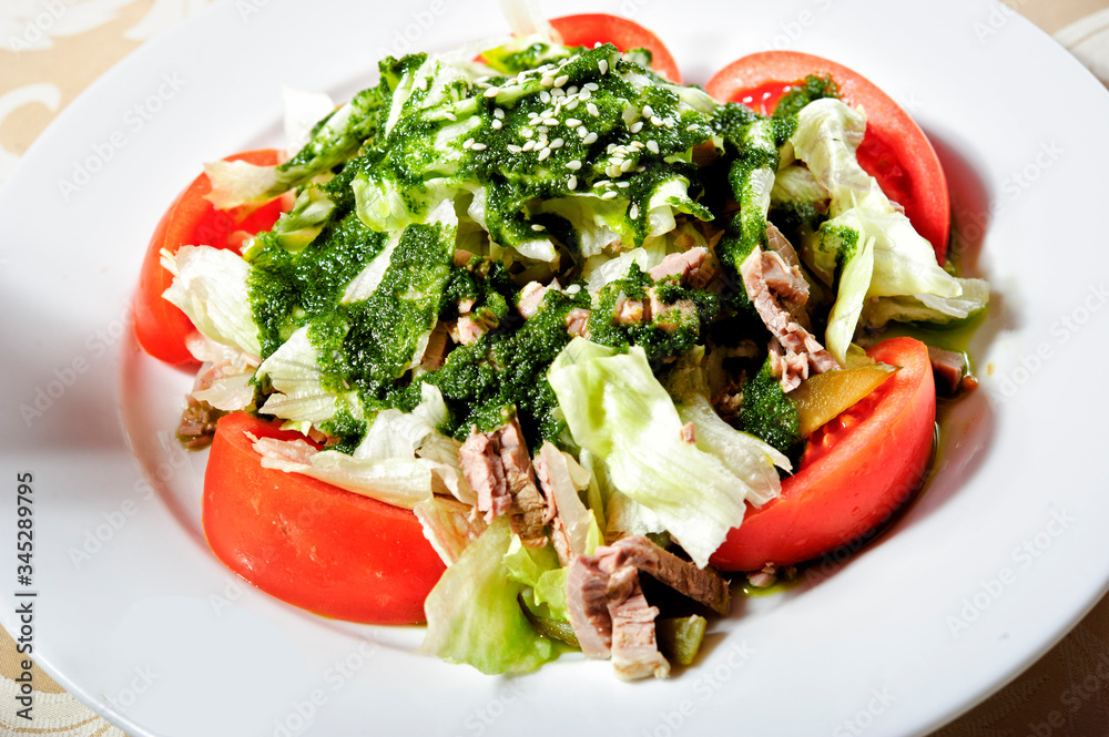 Meat salad,made of Strips of roast beef and sauteed vegetables.