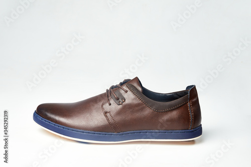 Men fashion brown shoe leather over white background. Pair casual stylish footwear.