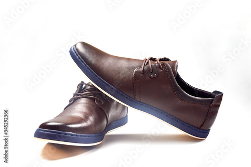 Men fashion brown shoe leather over white background. Pair casual stylish footwear.